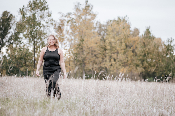 Michele Malbouef Intuitive Energy Healer Walking Through Grass